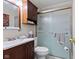 A compact bathroom featuring a single sink vanity and a shower with glass doors at 3427 Donald Ave, Indianapolis, IN 46224