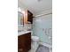 Cozy bathroom features a glass door shower, storage cabinet, and sleek fixtures at 3427 Donald Ave, Indianapolis, IN 46224