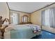 Cozy bedroom with blue carpet and a classic wooden dresser at 3427 Donald Ave, Indianapolis, IN 46224