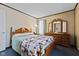 Bright bedroom featuring a wooden dresser and blue carpeting at 3427 Donald Ave, Indianapolis, IN 46224