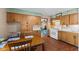 Eat-in kitchen features classic cabinetry, linoleum floor, and appliances at 3427 Donald Ave, Indianapolis, IN 46224
