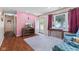 Inviting living room with wood-look floors and a large window at 3427 Donald Ave, Indianapolis, IN 46224