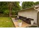 Backyard deck offers comfortable seating, a hammock, and a view of the surrounding greenery at 3431 W Mooresville Rd, Indianapolis, IN 46221
