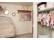 Bedroom with crib, closet, and stylish decor for a comfortable baby's room at 3431 W Mooresville Rd, Indianapolis, IN 46221