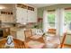 Inviting dining room with wood table, chairs, and view of kitchen at 3431 W Mooresville Rd, Indianapolis, IN 46221
