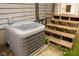 Exterior view of a home's AC unit and the backyard wooden porch stairs at 3431 W Mooresville Rd, Indianapolis, IN 46221