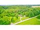 Serene property surrounded by mature trees, offering privacy and tranquility at 3512 N Wakeland Rd, Paragon, IN 46166