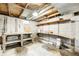 Unfinished basement with exposed ceiling, cement block walls, shelving, and a table at 3512 N Wakeland Rd, Paragon, IN 46166