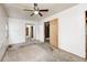 This bedroom features white walls, carpet, a window, a closet, and a ceiling fan with a light at 3512 N Wakeland Rd, Paragon, IN 46166
