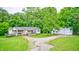 Charming single-story home with a covered porch, spacious yard, and detached two-car garage at 3512 N Wakeland Rd, Paragon, IN 46166