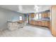 View of the kitchen featuring wood cabinetry, wood-look flooring, and a neutral color scheme at 3512 N Wakeland Rd, Paragon, IN 46166