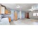 Spacious living area with wood-look floors connecting the kitchen with the front door entry area at 3512 N Wakeland Rd, Paragon, IN 46166