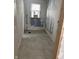 Bathroom featuring newly installed flooring and unfinished walls with a window and space for fixtures at 3526 Evergreen Ave, Indianapolis, IN 46205