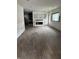 Living room featuring hardwood floors, fireplace with plaster walls, and natural light from the windows at 3526 Evergreen Ave, Indianapolis, IN 46205