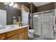 A well-lit bathroom with modern fixtures, vanity and enclosed shower at 3533 Alexandria Pike, Anderson, IN 46012
