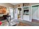 Bright bedroom featuring hardwood floors, a desk and adjacent bathroom for added convenience at 3533 Alexandria Pike, Anderson, IN 46012