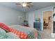 Cozy bedroom features a colorful quilt and an eclectic mix of furnishings at 3533 Alexandria Pike, Anderson, IN 46012