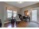 Comfortable bedroom with hardwood flooring, a reading chair, and lots of natural light at 3533 Alexandria Pike, Anderson, IN 46012