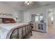 Charming bedroom showcasing a decorative bedframe and a stylish storage cabinet at 3533 Alexandria Pike, Anderson, IN 46012