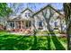 Charming two-story home featuring a welcoming front porch and well-manicured lawn at 3533 Alexandria Pike, Anderson, IN 46012
