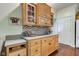 Kitchen featuring wood cabinets, granite countertops, and stylish backsplash at 3533 Alexandria Pike, Anderson, IN 46012