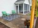 Inviting back patio with patio seating, colorful area rug, privacy screen, and lush potted flowers at 3862 Cornwallis Ln, Carmel, IN 46032