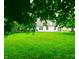 Expansive backyard showcasing lush green grass and a white home at 3862 Cornwallis Ln, Carmel, IN 46032