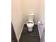 Tight shot of a bathroom toilet and a toilet paper holder in a modern setting at 3862 Cornwallis Ln, Carmel, IN 46032