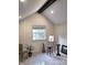 Bedroom featuring a vaulted ceiling and a large window at 3862 Cornwallis Ln, Carmel, IN 46032