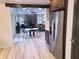 A stylish kitchen with stainless steel appliances, granite countertops, dark cabinets and open concept to the living room at 3862 Cornwallis Ln, Carmel, IN 46032