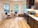 A modern kitchen featuring stainless steel appliances, granite countertops, dark cabinets, and natural light at 3862 Cornwallis Ln, Carmel, IN 46032