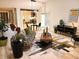 A living room featuring modern decor, a stylish sofa, a unique coffee table and an open concept to the kitchen at 3862 Cornwallis Ln, Carmel, IN 46032