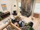 Bright living room with fireplace, modern furniture, and wood flooring at 3862 Cornwallis Ln, Carmel, IN 46032