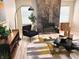 Stylish living room with stone fireplace, wood floors, and modern decor creating a cozy atmosphere at 3862 Cornwallis Ln, Carmel, IN 46032