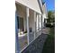 Enclosed patio featuring white posts and concrete flooring at 3862 Cornwallis Ln, Carmel, IN 46032