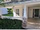 Inviting porch with brick columns, a white railing, and a view of the neighborhood at 3862 Cornwallis Ln, Carmel, IN 46032