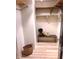 Walk-in closet with built-in shelves, a bench, and a wood-look floor at 3862 Cornwallis Ln, Carmel, IN 46032