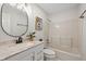 Bathroom featuring white vanity with black hardware and a tub with shower at 3926 Rosefinch Cir, Indianapolis, IN 46228