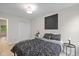 Bedroom features wood-look floors, a black-patterned comforter and a double-door closet at 3926 Rosefinch Cir, Indianapolis, IN 46228