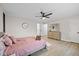 Bright bedroom featuring a dresser with a mirror, wood ceiling fan and light hardwood floors at 3926 Rosefinch Cir, Indianapolis, IN 46228
