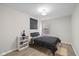 Bedroom features wood-look floors, a geometric art piece and a black-patterned comforter at 3926 Rosefinch Cir, Indianapolis, IN 46228