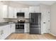 Kitchen featuring modern appliances, bright cabinets and granite countertops at 3926 Rosefinch Cir, Indianapolis, IN 46228