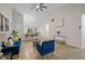 Living room featuring an open floor plan, hardwood floors and a kitchen bar area at 3926 Rosefinch Cir, Indianapolis, IN 46228