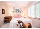 Bright bedroom features a rocking horse, natural light from a window, and neutral walls at 3935 Offshore Dr, Columbus, IN 47203