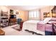 Spacious bedroom with a white bedspread and a large window overlooking a green lawn at 3935 Offshore Dr, Columbus, IN 47203