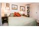 This bedroom offers a comfortable space with neutral walls, artwork, and a bookcase at 3935 Offshore Dr, Columbus, IN 47203