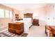 Bedroom with vintage wooden accents, including a trunk, nightstands, and headboard at 3935 Offshore Dr, Columbus, IN 47203
