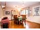 Bright dining room with hardwood floors, wainscoting, and a charming chandelier at 3935 Offshore Dr, Columbus, IN 47203