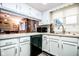 Bright kitchen with white cabinets, modern appliances, and convenient breakfast bar seating at 3935 Offshore Dr, Columbus, IN 47203