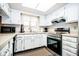 Modern kitchen with stainless steel appliances, white cabinets, and plenty of counter space at 3935 Offshore Dr, Columbus, IN 47203